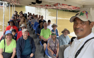 'Guests exploring the Tortuguero canal Nature Experience, walking through a tropical rainforest garden with bananas, cacao, coffee, bananas - Macaws Tours by Pablo C',